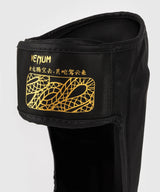 Protège-tibias Venum Serpenti – Noir/Or, VENUM-05757-109